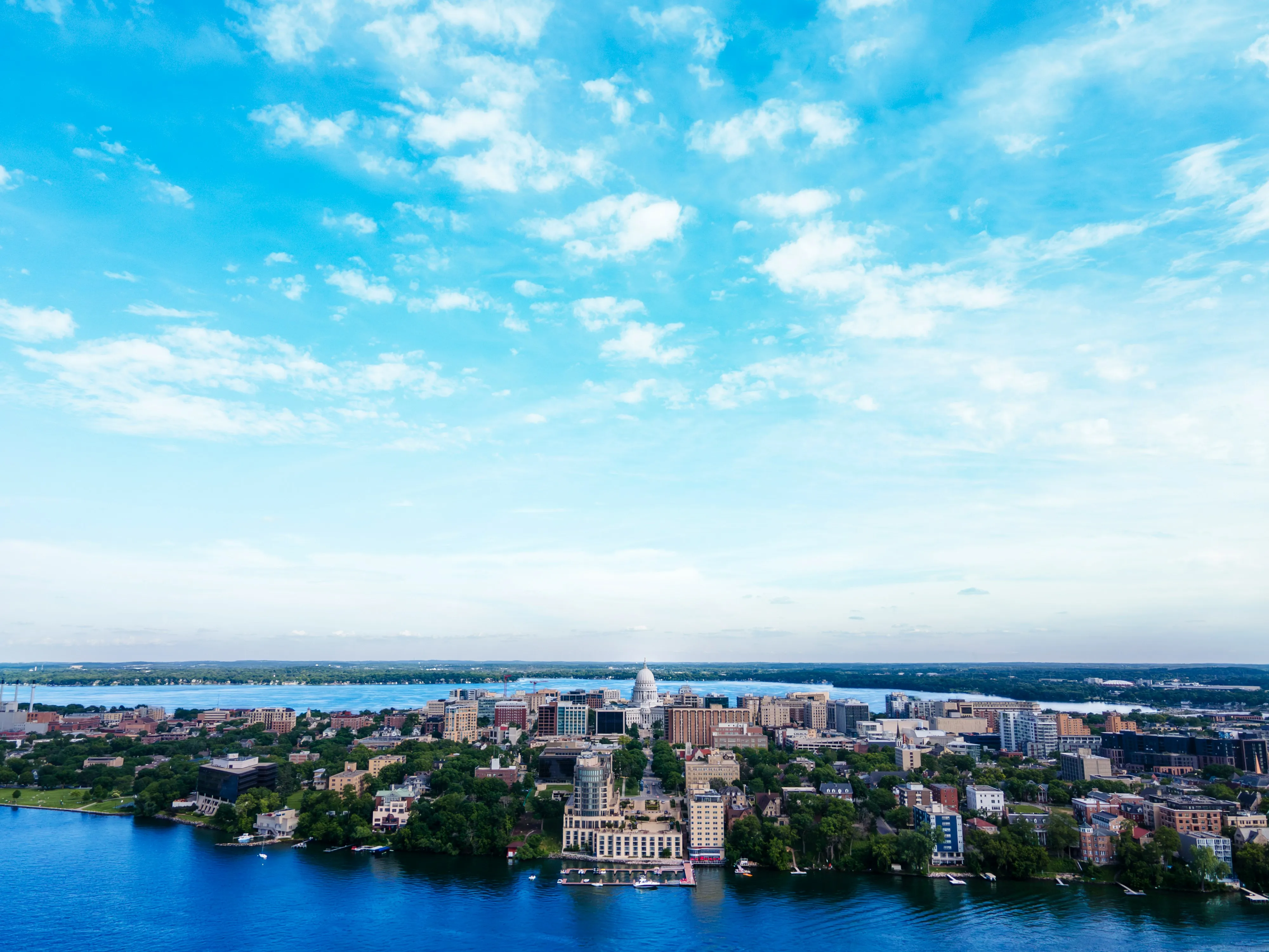 Aerial view of downtown Madison and the State Capitol between Lake Mendota and Lake Monona